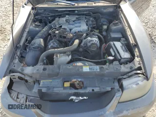 2004 Ford Mustang Standard with VIN 1FAFP40674F229138, listed as a Copart auction lot 56186445 with 128,566 mi miles and Salvage title. Bid and sale history available at DreamBid. Image 11.