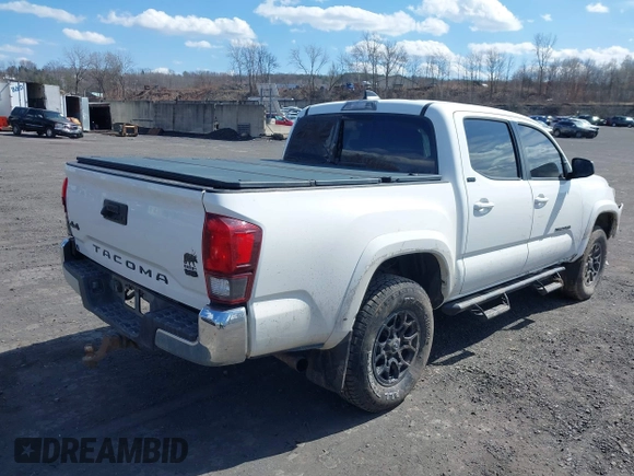 2020 Toyota Tacoma SR5 with VIN 3TMCZ5AN5LM339977, listed as a IAAI auction lot 41886937 with 94,986 mi miles and . Bid and sale history available at DreamBid. Image 4.