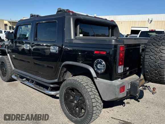 2005 Hummer H2 SUT with VIN 5GRGN22U35H113041, listed as a Copart auction lot 76730334 with 269,232 mi miles and Clean Title. Bid and sale history available at carsss.com. Image 3.