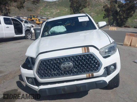 2019 Toyota Tacoma SR z VIN 3TMCZ5AN5KM249582, wystawiony jako IAAI lot #41925752 z przebiegiem 108 417 mil mil oraz . Historia ofert i sprzedaży dostępna na DreamBid. Obrazek 13.