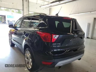 2019 Ford Escape Titanium with VIN 1FMCU9J96KUA01051, listed as a IAAI auction lot 42841649 with 69,720 mi miles and . Bid and sale history available at DreamBid. Image 6.