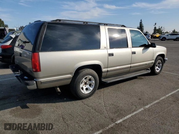 1999 GMC Suburban with VIN 3GKEC16R0XG526194, listed as a Copart auction lot 83740634 with 199,583 mi miles and Clean title. Bid and sale history available at DreamBid. Image 3.