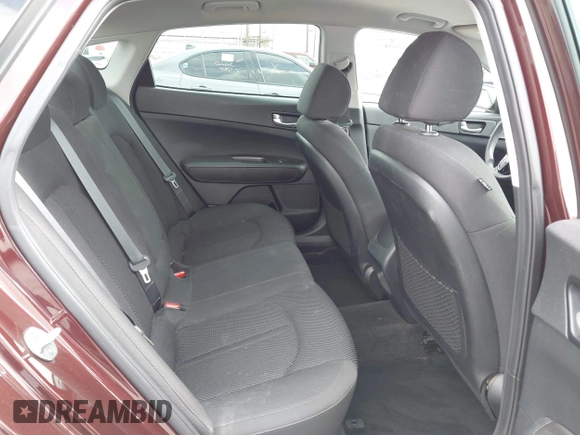 2019 Kia Optima LX z VIN 5XXGT4L37KG354649, wystawiony jako IAAI lot #42130410 z przebiegiem 61 315 mil mil oraz . Historia ofert i sprzedaży dostępna na DreamBid. Obrazek 8.