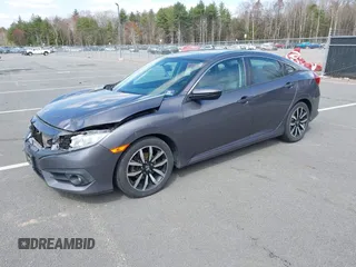 2016 Honda Civic Sedan EX-L with VIN 19XFC1F73GE201419, listed as a IAAI auction lot 42027720 with 168,134 mi miles. Bid and sale history available at carsss.com. Image 2.