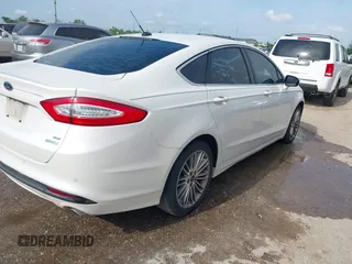 2014 Ford Fusion SE with VIN 3FA6P0HD8ER169211, listed as a IAAI auction lot 42038877 with 215,769 mi miles. Bid and sale history available at carsss.com. Image 4.