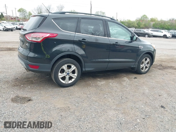 2015 Ford Escape SE with VIN 1FMCU9GX8FUA13813, listed as a IAAI auction lot 42075105 with 109,737 mi miles. Bid and sale history available at carsss.com. Image 4.