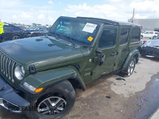 2022 Jeep Wrangler Unlimited Sahara Altitude with VIN 1C4HJXEG3NW194042, listed as a IAAI auction lot 42643314 with 32,091 mi miles and . Bid and sale history available at DreamBid. Image 6.