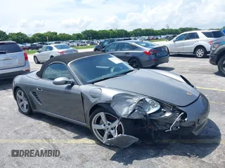 2007 Porsche Boxster z VIN WP0CA29877U710966, wystawiony jako IAAI lot #39794748 z przebiegiem 147 803 mil mil oraz . Historia ofert i sprzedaży dostępna na DreamBid. Obrazek 6.