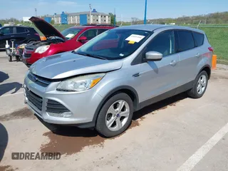 2016 Ford Escape SE with VIN 1FMCU9G98GUA10333, listed as a IAAI auction lot 42021490 with 128,973 mi miles. Bid and sale history available at carsss.com. Image 2.