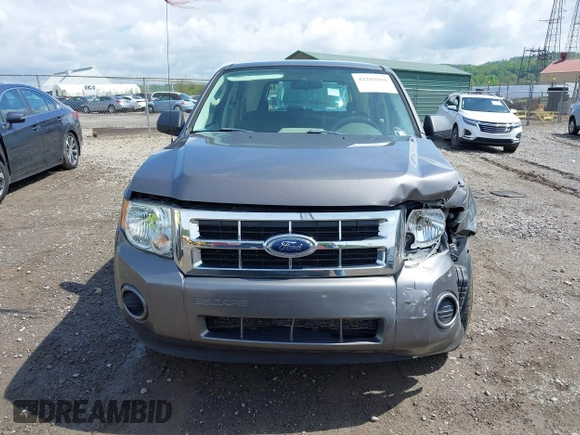 2009 Ford Escape XLS z VIN 1FMCU02709KC11692, wystawiony jako IAAI lot #42202890 z przebiegiem 155 243 mil mil oraz . Historia ofert i sprzedaży dostępna na DreamBid. Obrazek 12.