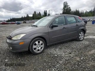 2002 Ford Focus ZX5 z VIN 3FAFP37352R172380, wystawiony jako Copart lot #57418195 z przebiegiem 102 675 mil mil oraz Szkoda całkowita • Salvage title. Historia ofert i sprzedaży dostępna na DreamBid. Obrazek 1.