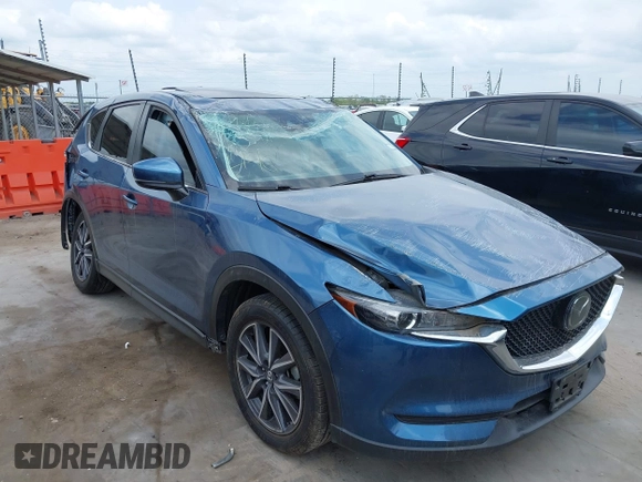2018 Mazda CX-5 Touring z VIN JM3KFACM5J1442416, wystawiony jako IAAI lot #42093137 z przebiegiem 65 102 mil mil oraz . Historia ofert i sprzedaży dostępna na DreamBid. Obrazek 6.