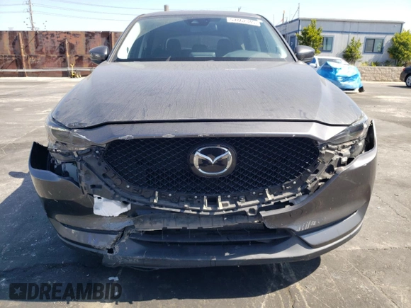 2019 Mazda CX-5 Grand Touring with VIN JM3KFADM6K1641992, listed as a Copart auction lot 57862345 with 37,100 mi miles and Salvage title. Bid and sale history available at DreamBid. Image 5.