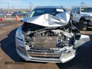 2015 Ford Escape Titanium with VIN 1FMCU0J93FUC02844, listed as a IAAI auction lot 41531293 with 115,392 mi miles and . Bid and sale history available at DreamBid. Image 13.