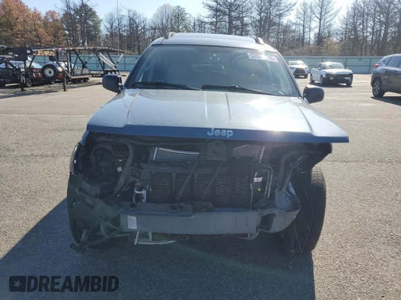 2004 Jeep Grand Cherokee Laredo z VIN 1J4GW48S74C159381, wystawiony jako Copart lot #53972115 z przebiegiem 128 309 mil mil oraz Szkoda całkowita • Salvage title. Historia ofert i sprzedaży dostępna na DreamBid. Obrazek 5.