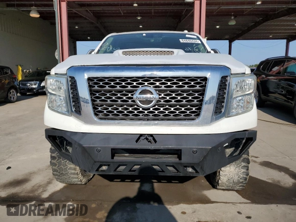 2016 Nissan Titan Platinum Reserve z VIN 1N6BA1F21GN513109, wystawiony jako Copart lot #64840434 z przebiegiem 94 263 mil mil oraz Czysty tytuł • Clean title. Historia ofert i sprzedaży dostępna na DreamBid. Obrazek 5.