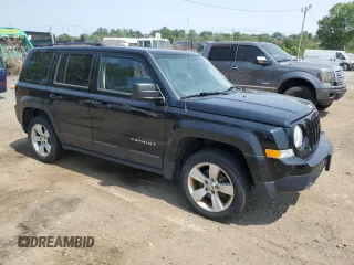2014 Jeep Patriot Latitude with VIN 1C4NJRFB3ED761587, listed as a Copart auction lot 60554245 with 138,763 mi miles and Salvage title. Bid and sale history available at DreamBid. Image 4.