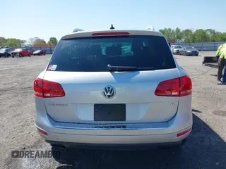 2014 Volkswagen Touareg Sport with VIN WVGEF9BP6ED007436, listed as a IAAI auction lot 41953307 with 114,925 mi miles and . Bid and sale history available at DreamBid. Image 16.