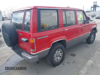 1991 Isuzu Trooper z VIN JACCH58R0M7904092, wystawiony jako IAAI lot #41900283 z przebiegiem 226 780 mil mil oraz . Historia ofert i sprzedaży dostępna na DreamBid. Obrazek 4.