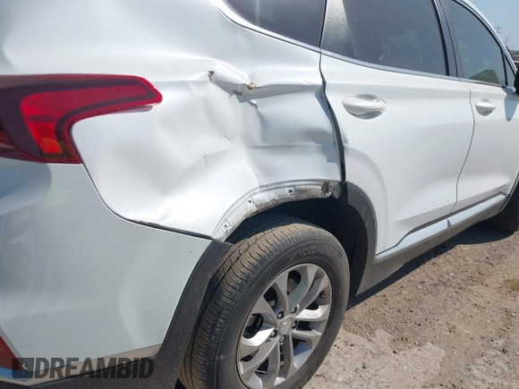2019 Hyundai Santa Fe SE with VIN 5NMS23AD8KH051223, listed as a IAAI auction lot 42017754 with 146,704 mi miles and . Bid and sale history available at DreamBid. Image 16.