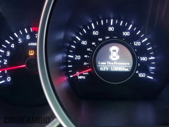 2015 Kia Optima LX with VIN 5XXGM4A74FG381316, listed as a IAAI auction lot 41885940 with 128,984 mi miles. Bid and sale history available at carsss.com. Image 7.
