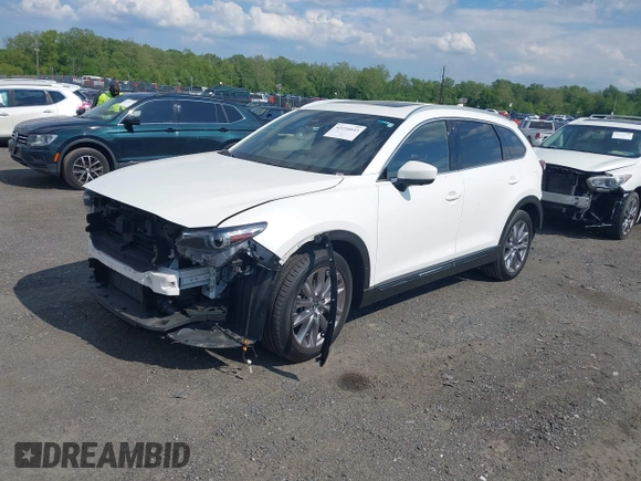 2021 Mazda CX-9 Grand Touring with VIN JM3TCBDY2M0541290, listed as a IAAI auction lot 42216643 with 38,661 mi miles and . Bid and sale history available at DreamBid. Image 2.
