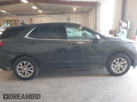 2018 Chevrolet Equinox LT z VIN 3GNAXJEV5JS569101, wystawiony jako IAAI lot #42055496 z przebiegiem 173 494 mil mil oraz . Historia ofert i sprzedaży dostępna na DreamBid. Obrazek 13.
