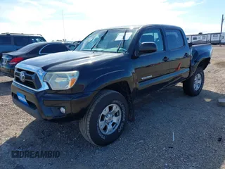 2015 Toyota Tacoma with VIN 3TMLU4EN2FM169326, listed as a IAAI auction lot 40689500 with 77,003 mi miles and . Bid and sale history available at DreamBid. Image 2.