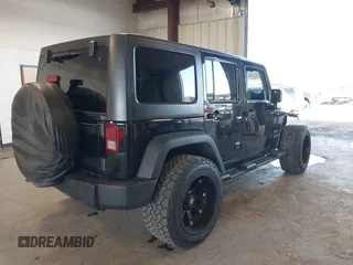 2012 Jeep Wrangler Unlimited Sport with VIN 1C4BJWDG8CL246829, listed as a IAAI auction lot 41816197 with 198,502 mi miles. Bid and sale history available at carsss.com. Image 4.