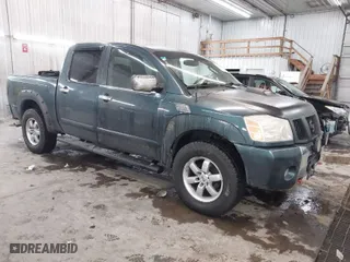 2004 Nissan Titan LE with VIN 1N6AA07B14N511618, listed as a IAAI auction lot 41336419 with 195,863 mi miles. Bid and sale history available at carsss.com. Image 1.