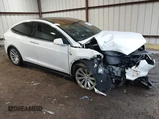 2018 Tesla Model X 75D with VIN 5YJXCBE24JF138297, listed as a IAAI auction lot 41058224 with 72,892 mi miles. Bid and sale history available at carsss.com. Image 1.
