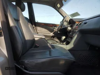 2002 Mercedes-Benz E-Class with VIN WDBJF65J22B490275, listed as a Copart auction lot 51128565 with 142,232 mi miles and Salvage Title. Bid and sale history available at carsss.com. Image 7.