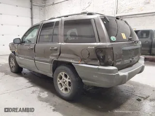 1999 Jeep Grand Cherokee Laredo with VIN 1J4GW58SXXC584734, listed as a IAAI auction lot 41902224 with 209,180 mi miles. Bid and sale history available at carsss.com. Image 3.