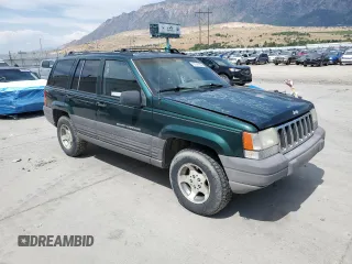 1996 Jeep Grand Cherokee Laredo z VIN 1J4GZ58S8TC222435, wystawiony jako Copart lot #62347665 z przebiegiem 202 125 mil mil oraz Czysty tytuł • Clean title. Historia ofert i sprzedaży dostępna na DreamBid. Obrazek 4.