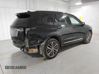 2023 Cadillac XT6 AWD Sport z VIN 1GYKPGRS3PZ133580, wystawiony jako Copart lot #44825095 z przebiegiem 12 168 mil mil oraz Czysty tytuł • Clean title. Historia ofert i sprzedaży dostępna na DreamBid. Obrazek 3.