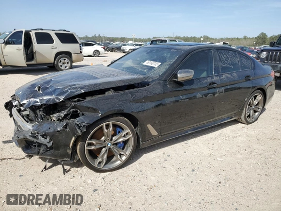 2020 BMW 5 Series M550i xDrive z VIN WBAJS7C01LCD23365, wystawiony jako Copart lot #49166705 z przebiegiem 42 293 mil mil oraz Szkoda całkowita • Salvage title. Historia ofert i sprzedaży dostępna na DreamBid. Obrazek 1.