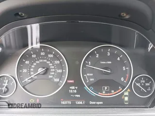 2014 BMW 3 Series 328d xDrive with VIN WBA3D5C59EKX96701, listed as a IAAI auction lot 40716972 with 163,775 mi miles. Bid and sale history available at carsss.com. Image 7.