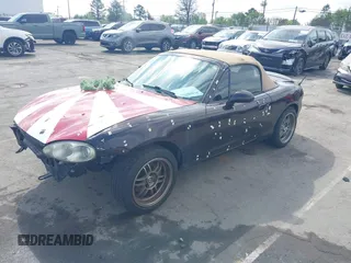 2004 Mazda MX-5 Miata LS with VIN JM1NB353040409951, listed as a IAAI auction lot 41848965 with 125,750 mi miles and . Bid and sale history available at DreamBid. Image 2.