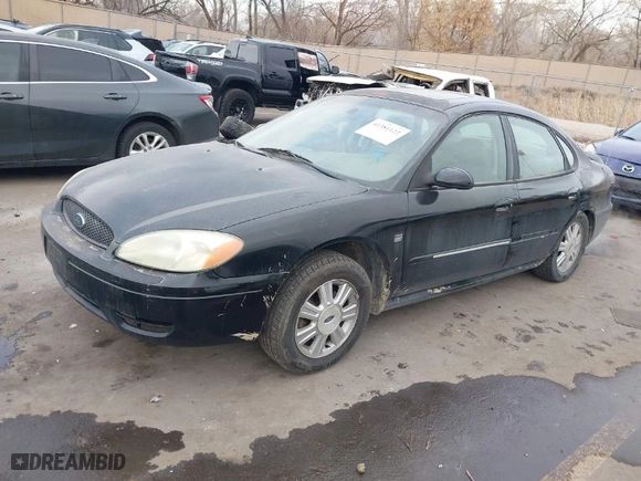 2004 Ford Taurus SEL with VIN 1FAHP56S44A129658, listed as a IAAI auction lot 41381122 with 298,335 mi miles. Bid and sale history available at carsss.com. Image 2.