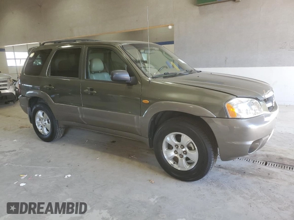 2002 Mazda Tribute LX with VIN 4F2YU09142KM39082, listed as a Copart auction lot 49973375 with 128,002 mi miles and Clean Title. Bid and sale history available at carsss.com. Image 4.