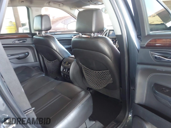 2014 Cadillac SRX Premium Collection z VIN 3GYFNDE31ES653114, wystawiony jako IAAI lot #42107858 z przebiegiem 125 192 mil mil oraz . Historia ofert i sprzedaży dostępna na DreamBid. Obrazek 8.