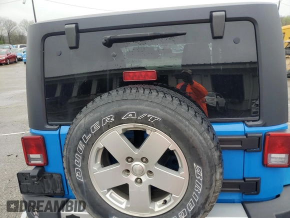 2012 Jeep Wrangler Arctic z VIN 1C4AJWBG3CL148046, wystawiony jako Copart lot #54186285 z przebiegiem 156 639 mil mil oraz Szkoda całkowita • Salvage title. Historia ofert i sprzedaży dostępna na DreamBid. Obrazek 11.