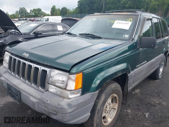 1996 Jeep Grand Cherokee with VIN 1J4EZ58Y7TC128302, listed as a IAAI auction lot 42643449 with 282,036 mi miles and . Bid and sale history available at DreamBid. Image 6.