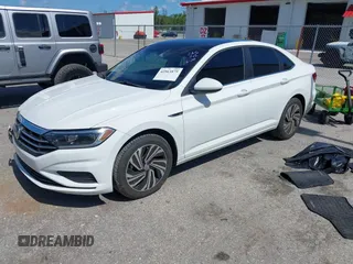 2021 Volkswagen Jetta SEL with VIN 3VWE57BU2MM047028, listed as a IAAI auction lot 42563875 with 56,695 mi miles and . Bid and sale history available at DreamBid. Image 2.