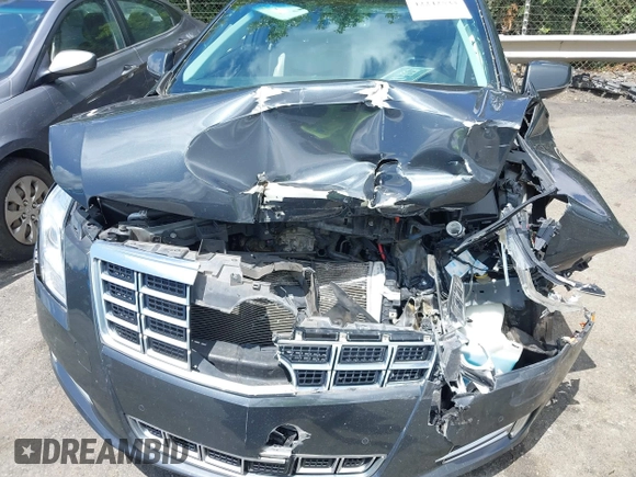 2013 Cadillac XTS Luxury z VIN 2G61P5S34D9109189, wystawiony jako IAAI lot #42242533 z przebiegiem 178 234 mil mil oraz . Historia ofert i sprzedaży dostępna na DreamBid. Obrazek 6.
