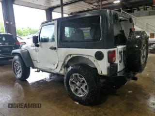 2013 Jeep Wrangler Rubicon 10th Anniversary z VIN 1C4BJWCGXDL543958, wystawiony jako Copart lot #58492255 z przebiegiem 94 455 mil mil oraz Szkoda całkowita • Salvage title. Historia ofert i sprzedaży dostępna na DreamBid. Obrazek 2.
