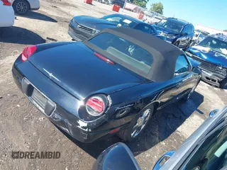 2002 Ford Thunderbird w/Hardtop Premium with VIN 1FAHP60AX2Y116200, listed as a IAAI auction lot 40129557 with 88,991 mi miles. Bid and sale history available at carsss.com. Image 4.
