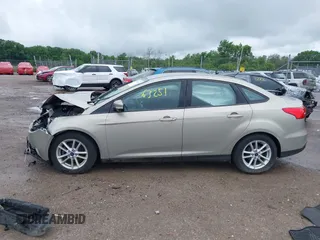 2016 Ford Focus SE z VIN 1FADP3F28GL300925, wystawiony jako IAAI lot #42563251 z przebiegiem 93 247 mil mil oraz . Historia ofert i sprzedaży dostępna na DreamBid. Obrazek 15.