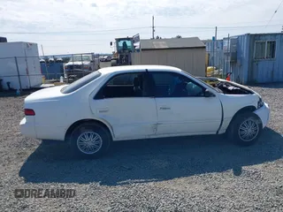1999 Toyota Camry LE z VIN 4T1BG22K0XU862535, wystawiony jako IAAI lot #42116856 z przebiegiem 186 094 mil mil oraz . Historia ofert i sprzedaży dostępna na DreamBid. Obrazek 14.
