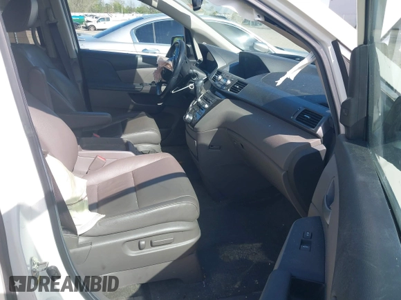 2013 Honda Odyssey Touring with VIN 5FNRL5H96DB009694, listed as a IAAI auction lot 42002487 with 182,867 mi miles and . Bid and sale history available at carsss.com. Image 5.
